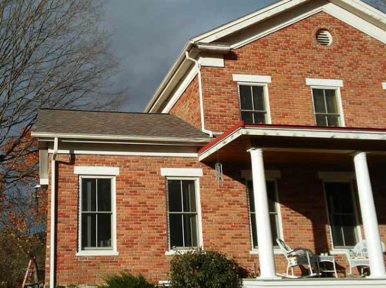 Historical brick building with brand new shingles.