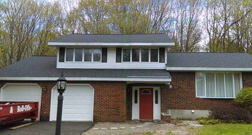 Brick two story house with new roof